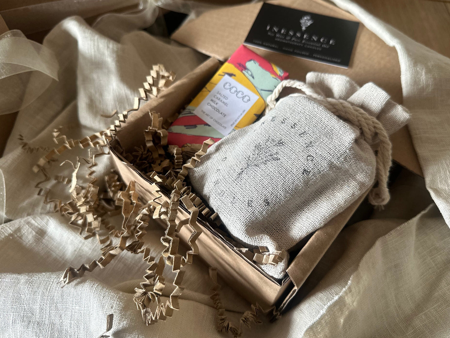 an open box with a book and some other items in it