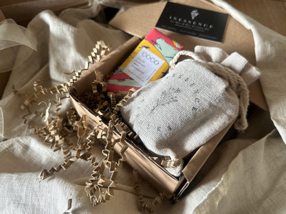 an open box with a book and some other items in it