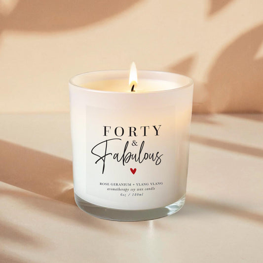 40th Birthday Aromatherapy Candle Gift with a label that says forty and fabulous and little heart. An all natural candle using only pure essential oils and soy wax