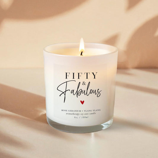50th Birthday Aromatherapy Candle Gift with a label that says 50 and fabulous and little heart. An all natural candle using only pure essential oils and soy wax