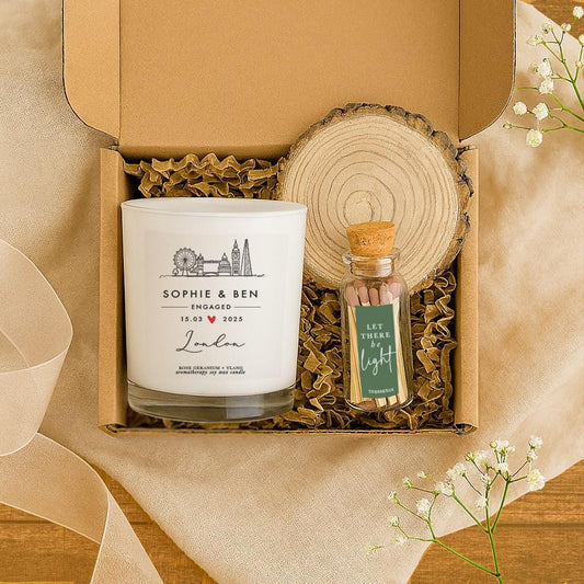 Personalised London engagement soy wax candle with custom label, wooden coaster and glass match bottle displayed on a neutral gift setting.