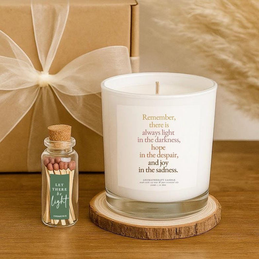 white candle with label that reads Remember,
there is
always light 
in the darkness,
hope 
in the despair,
and joy 
in the sadness.