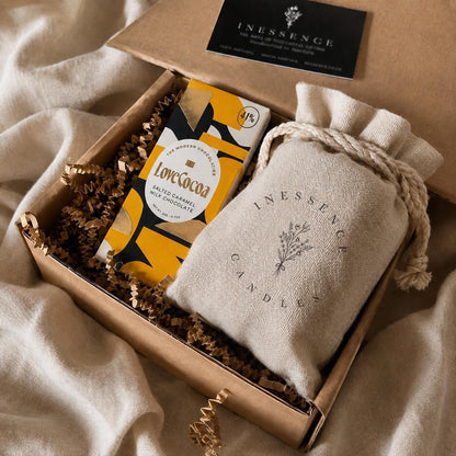 an open box with a book and some other items in it